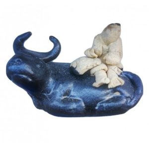 Man sitting on Water Buffalo